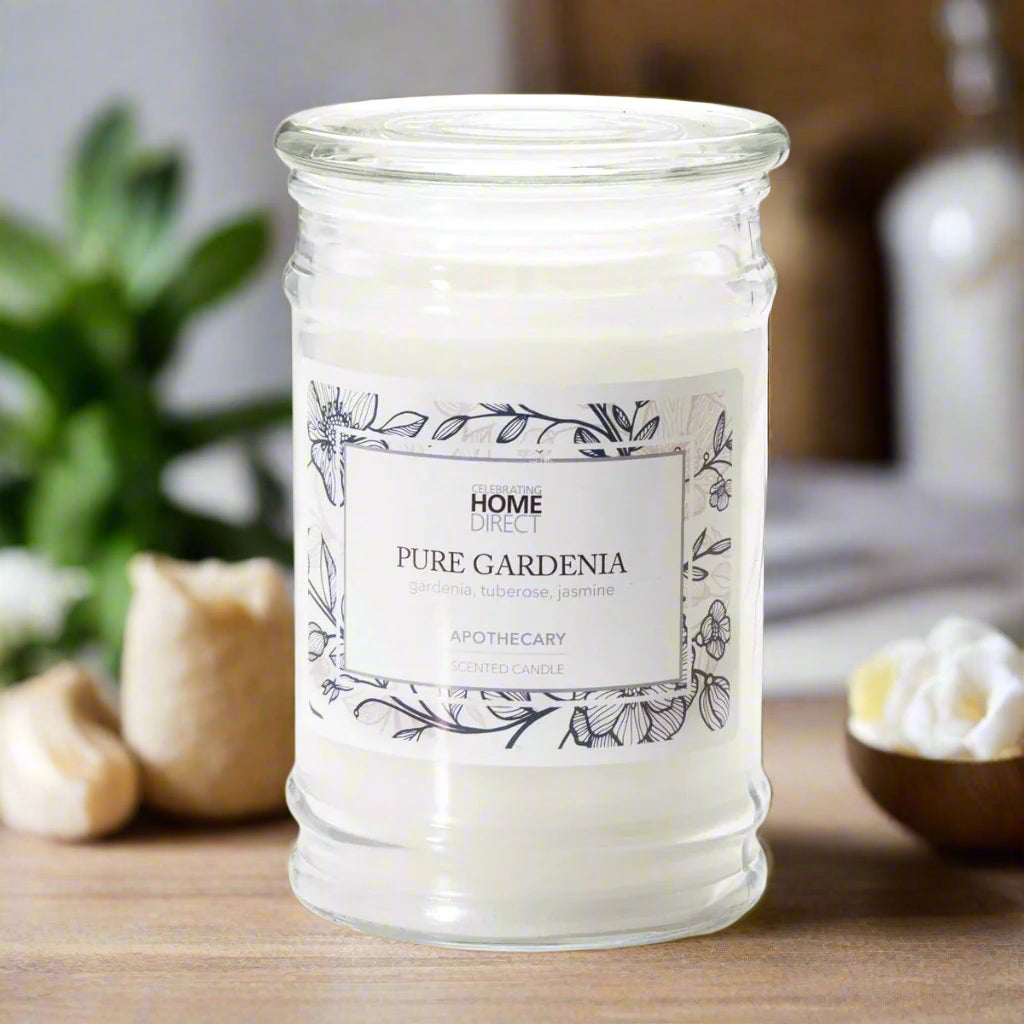 Candle Pure Gardenia in a glass jar with a label on a gray background